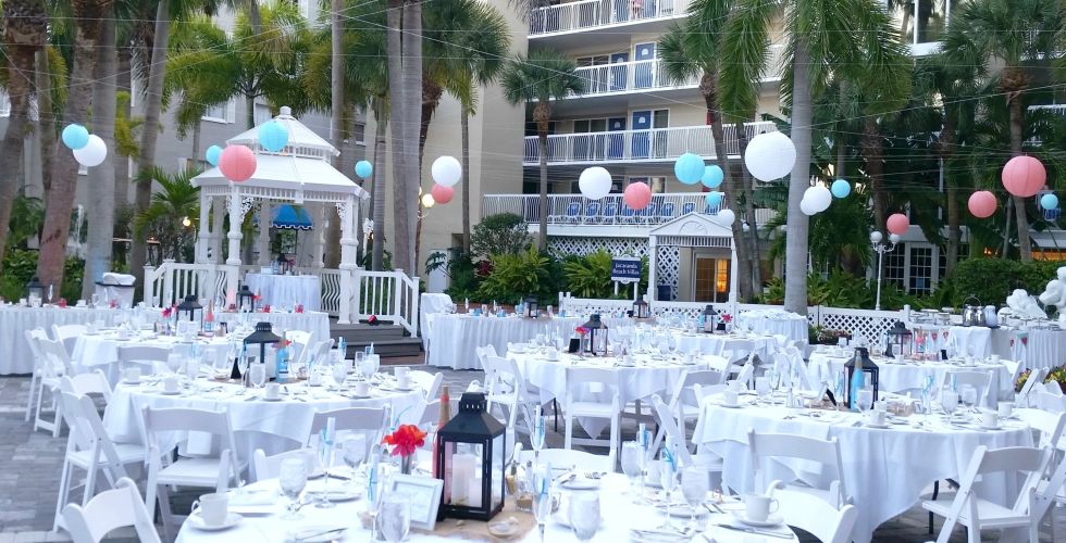 A Group Of People Sitting At A Table Covered In Snow