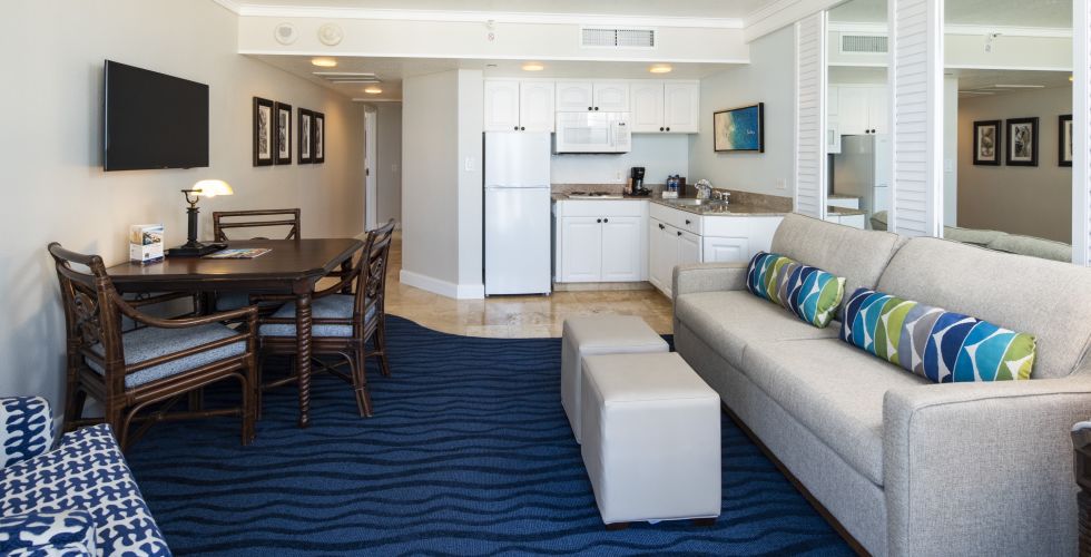 A Living Room Filled With Furniture And A Large Window