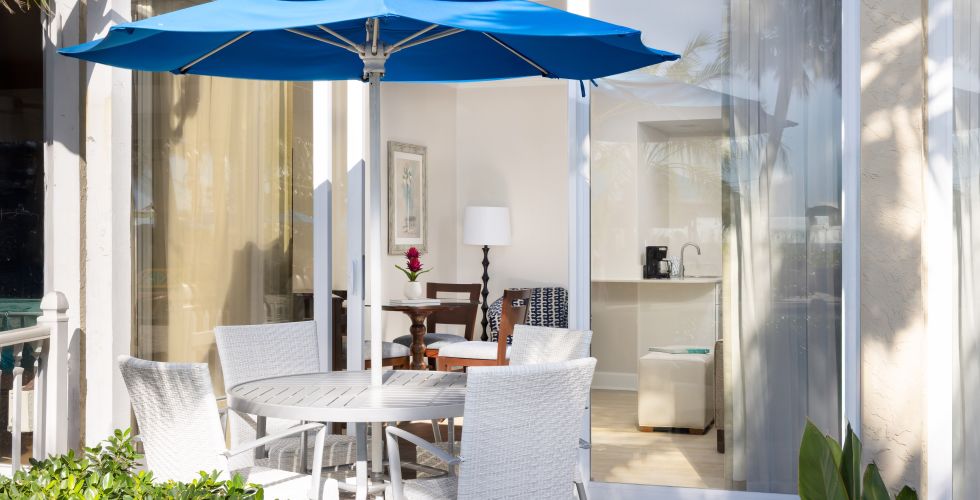 A Patio With A Table And Chairs