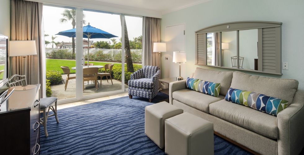 A Living Room Filled With Furniture And A Large Window