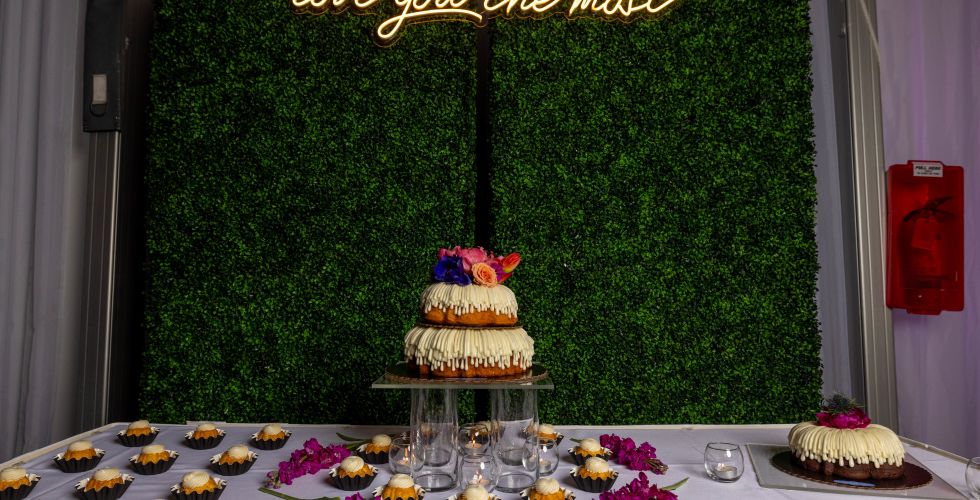 A Cake With A Sign On It