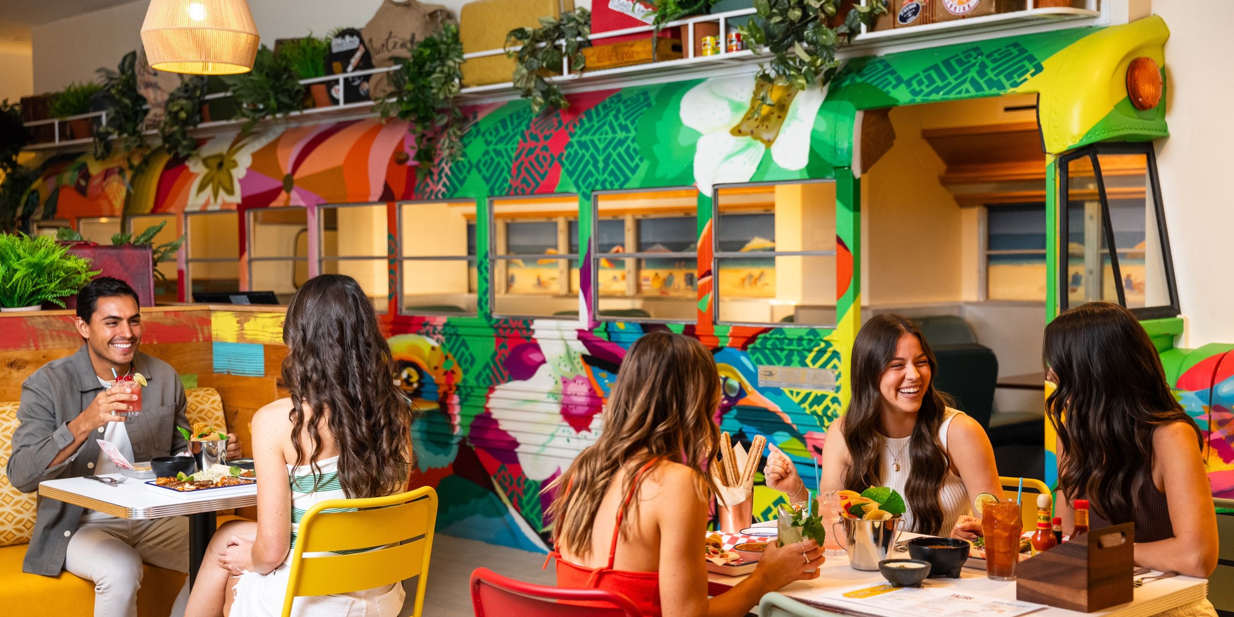 A Group Of People Sitting At A Table