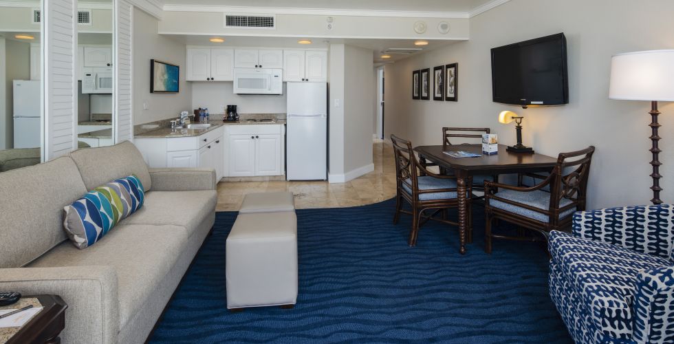 A Living Room Filled With Furniture And A Rug