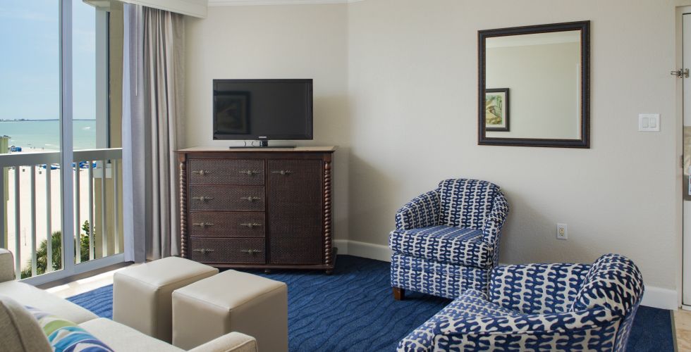 A Living Room Filled With Furniture And A Large Window