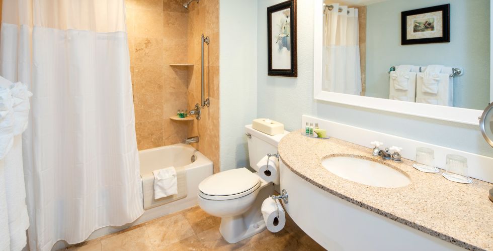 A Shower That Has A Sink And A Mirror