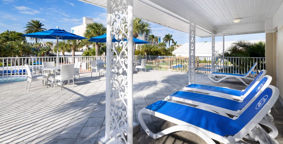 A Swimming Pool With A White Canopy