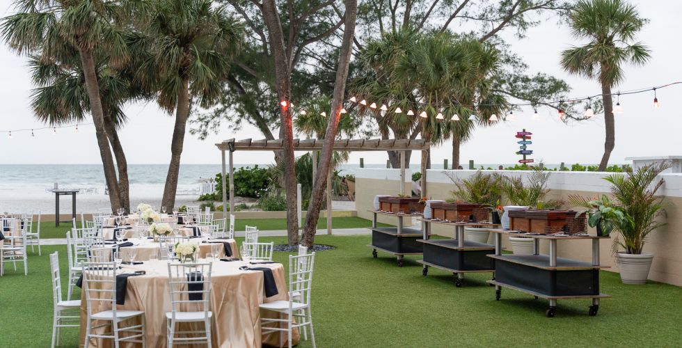 A Group Of Tables And Chairs Outside