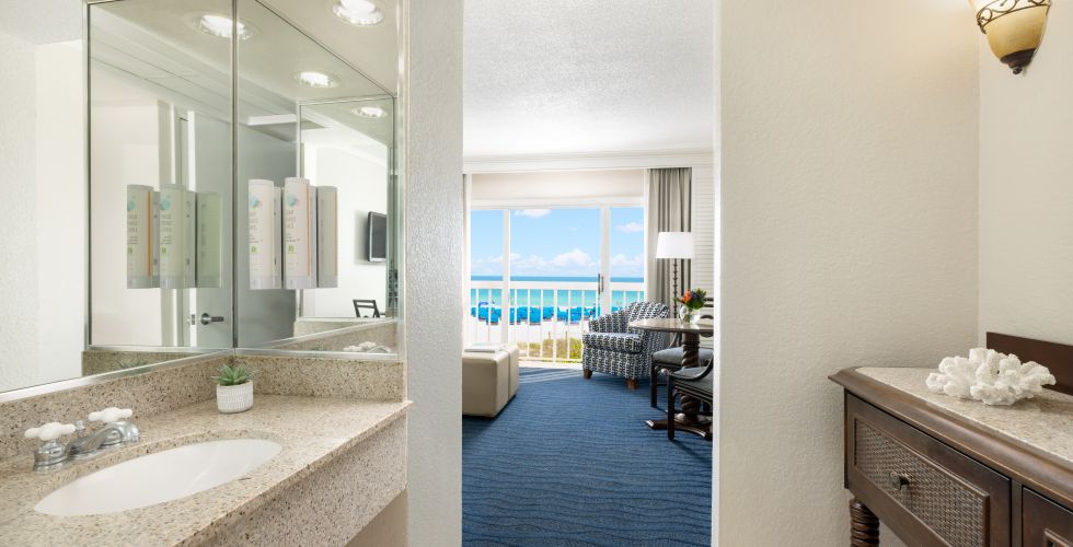 A Bathroom With A Large Mirror