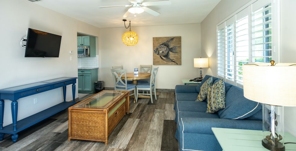 A Living Room With A Blue Couch