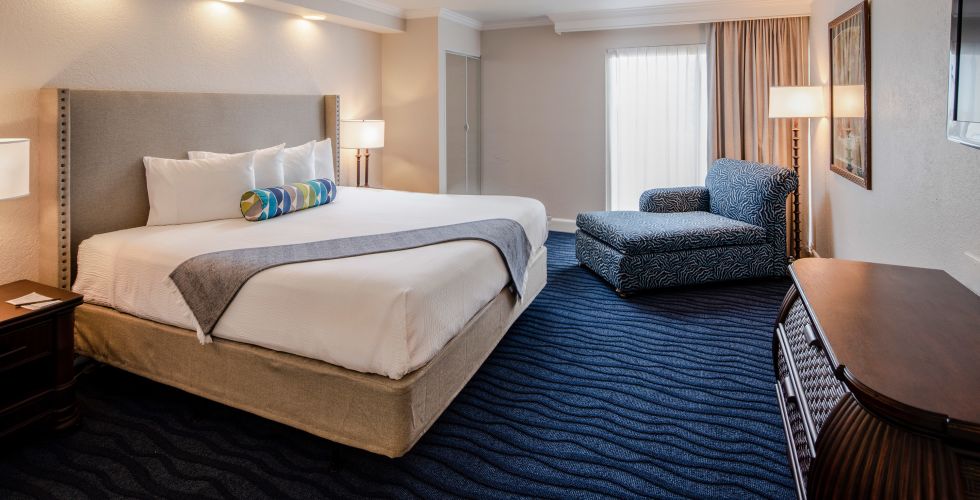 A Double Bed In A Hotel Room