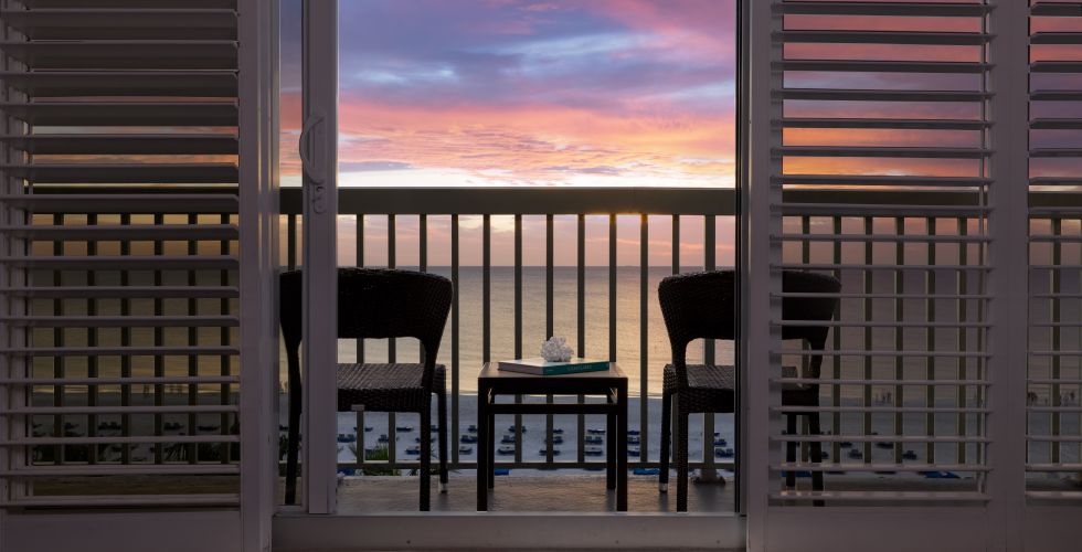 A Table And Chairs On A Balcony
