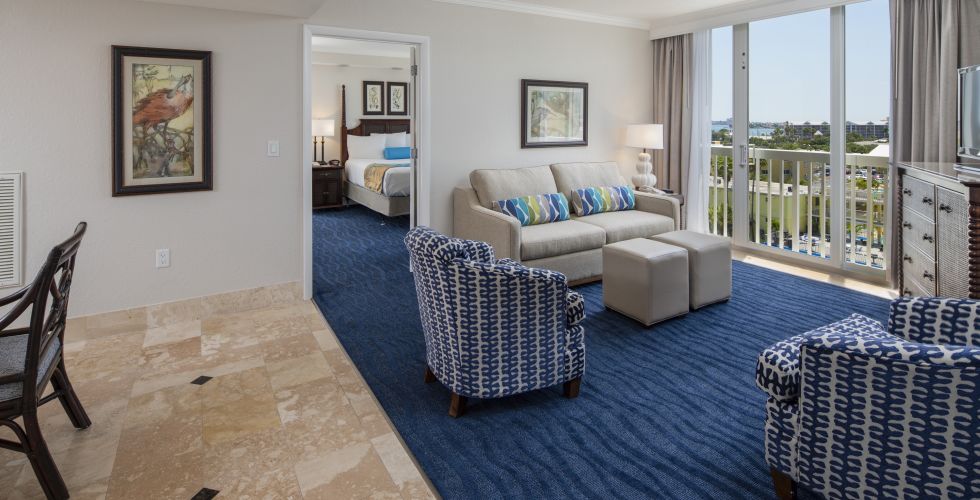 A Living Room Filled With Furniture And A Large Window