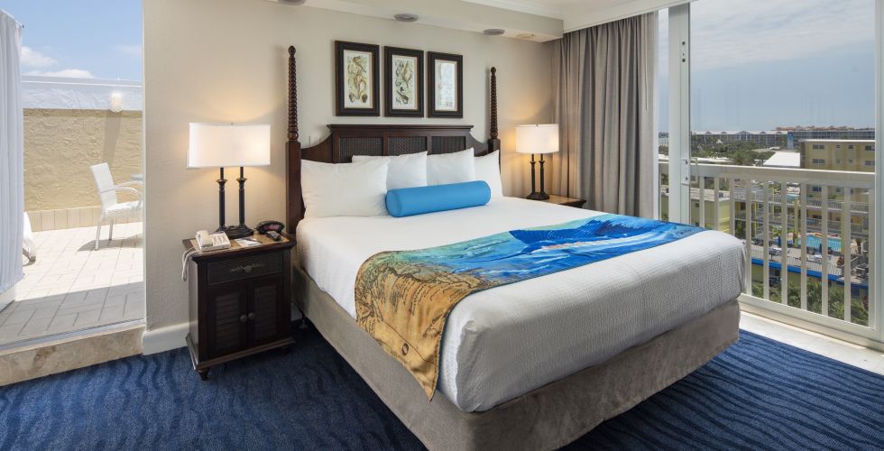 A Bedroom With A Large Bed In A Hotel Room