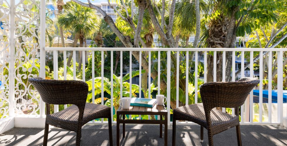 A Patio With Chairs And Tables