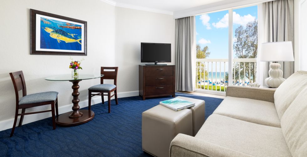A Living Room With A Blue Rug