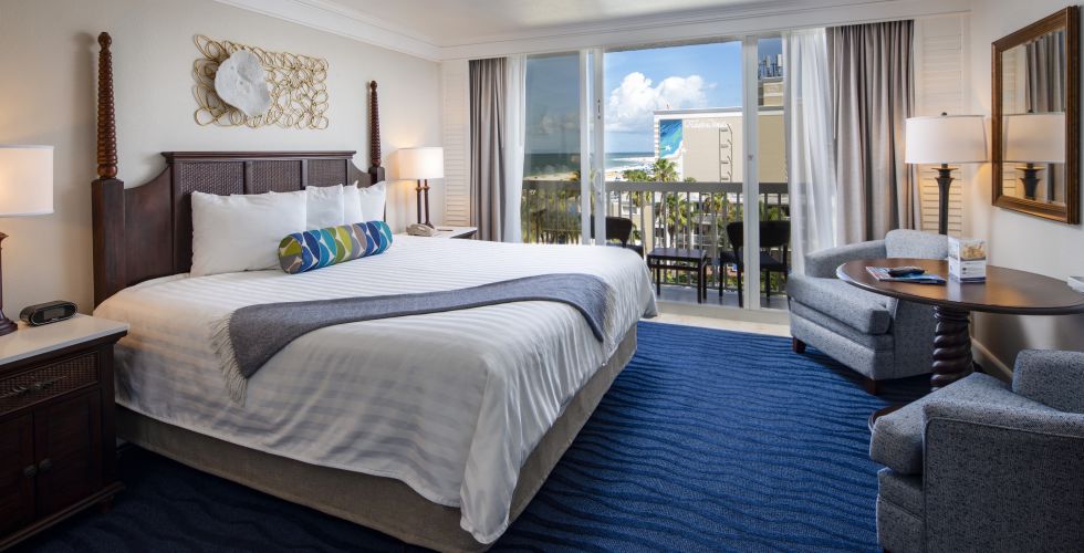 A Bedroom With A Large Bed In A Hotel Room