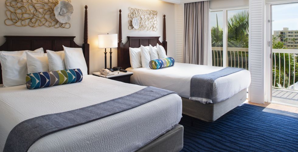 A Bedroom With A Large Bed In A Hotel Room