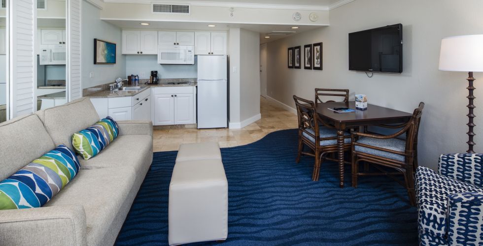 A Living Room Filled With Furniture And A Rug