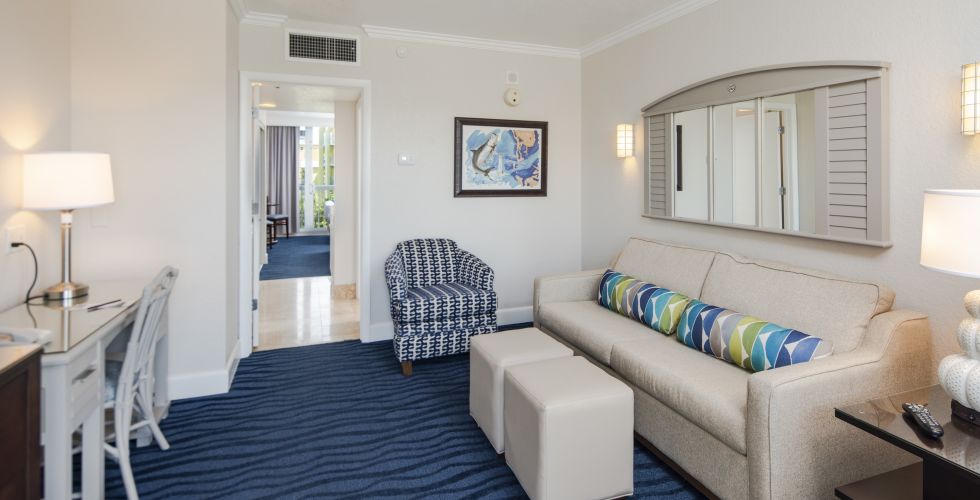 A Living Room Filled With Furniture And A Bed