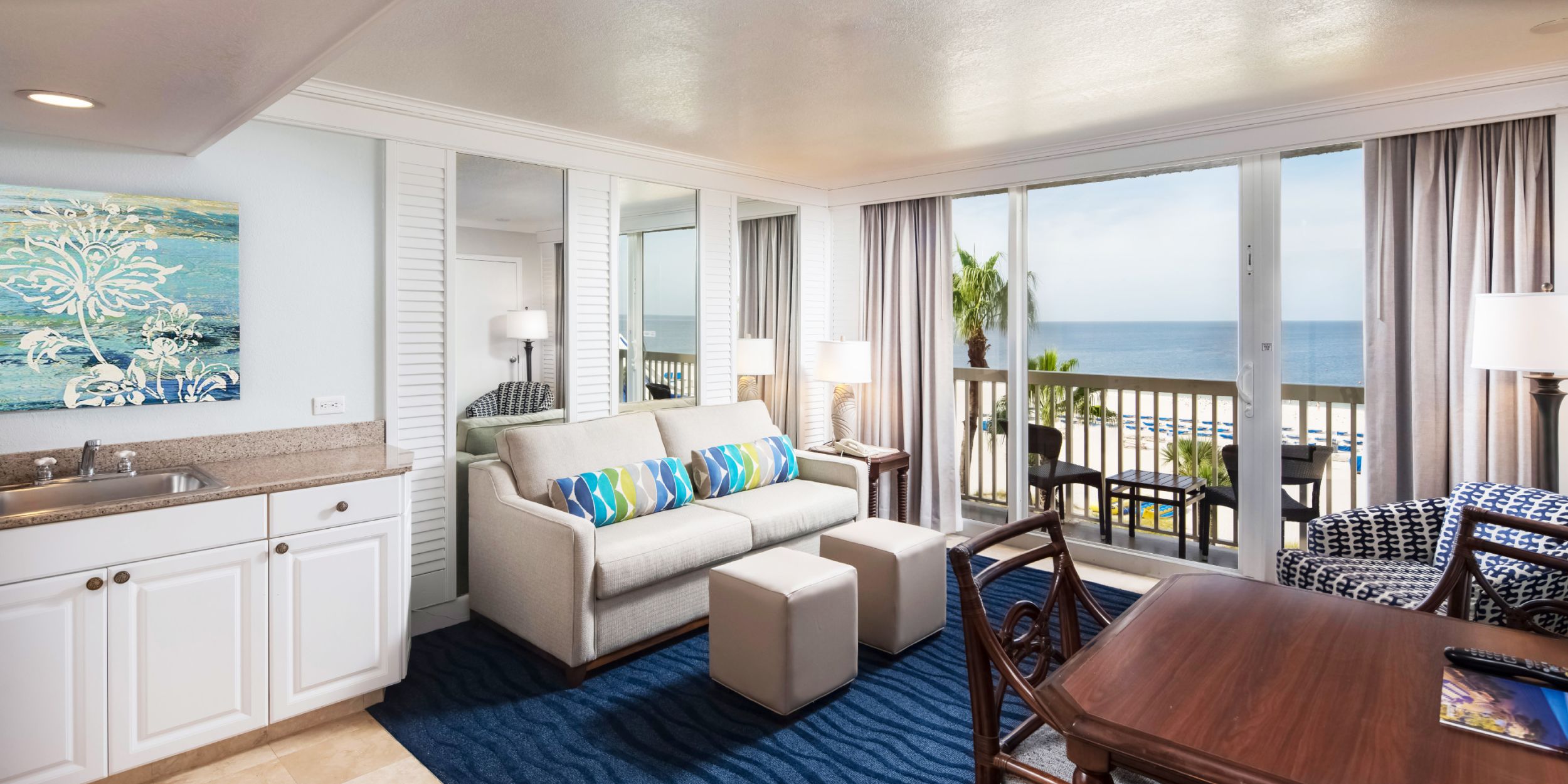 A Room Filled With Furniture And A Large Window