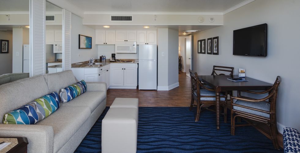 A Living Room Filled With Furniture And A Rug