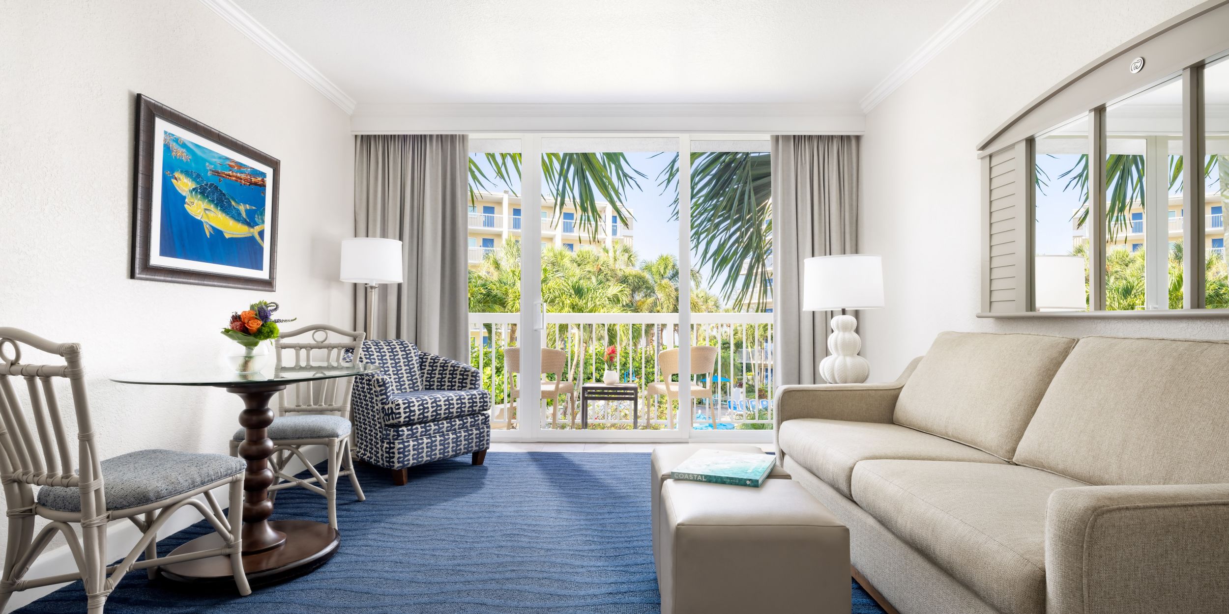 A Living Room With A Blue Rug