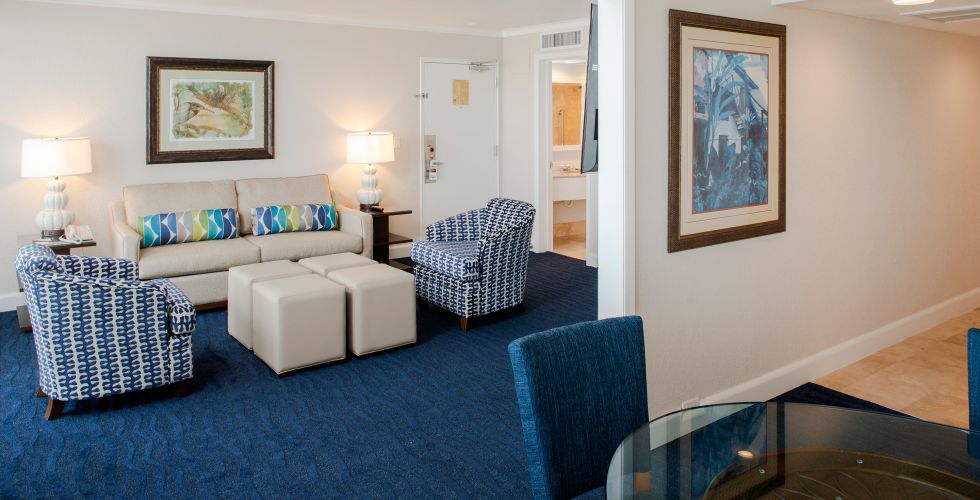 A Living Room With A Blue Chair