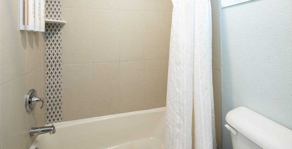 A Bathroom With A Bathtub And Toilet