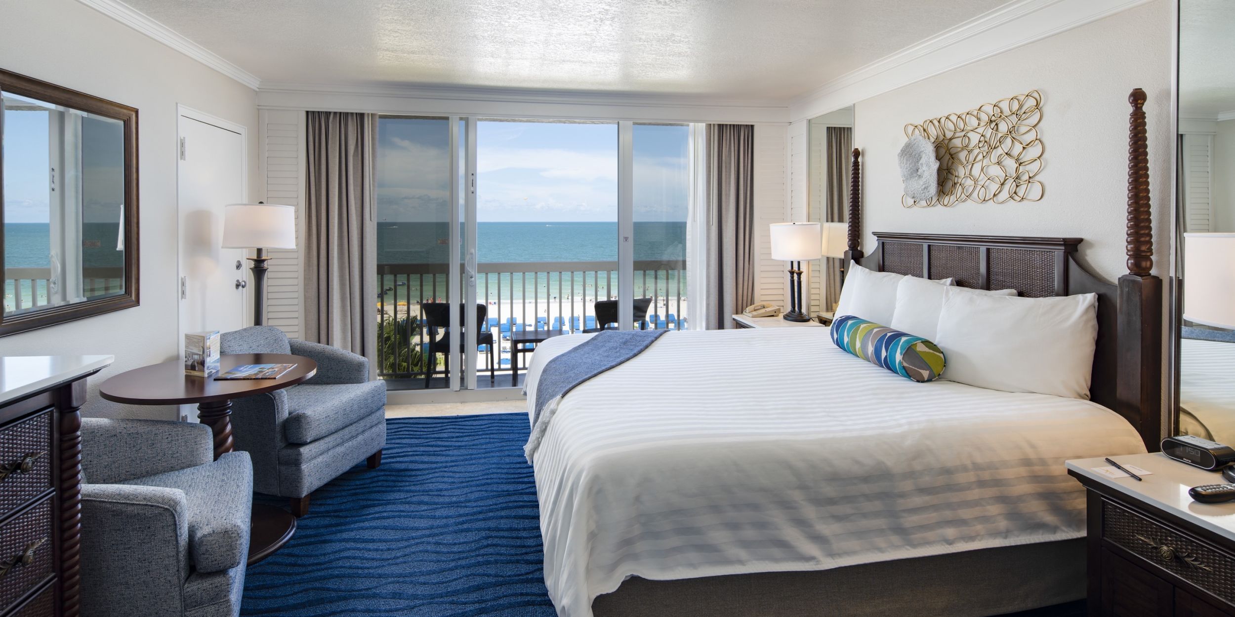 A Bedroom With A Large Bed In A Hotel Room