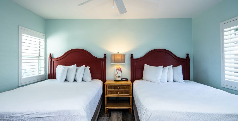 A Couple Of Beds In A Room