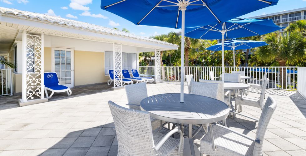 A Patio With Tables And Chairs