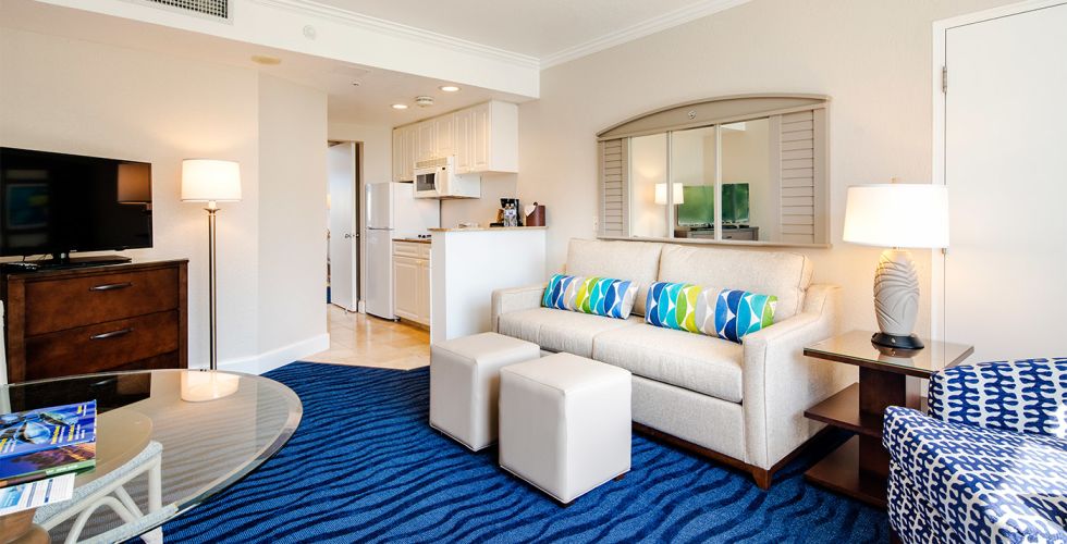 A Living Room Filled With Furniture And A Flat Screen Tv
