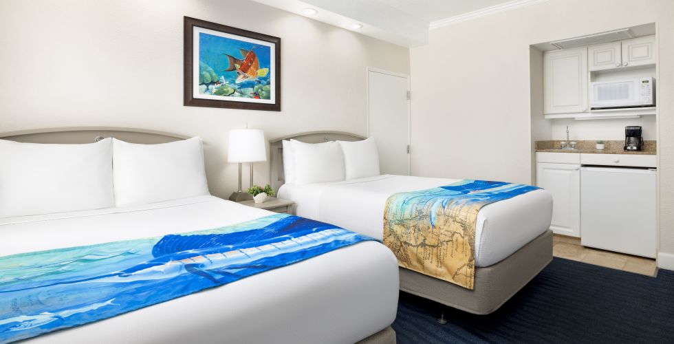 A Couple Of Beds In A Room