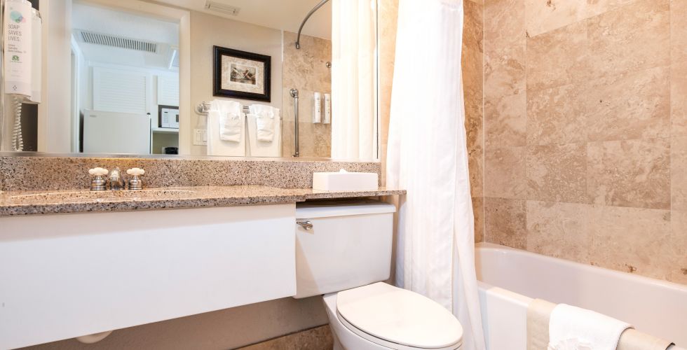 A Bathroom With A Tub Toilet And Sink