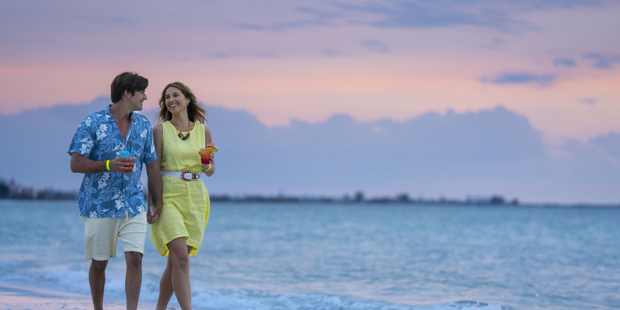 A Person Standing In Front Of Water