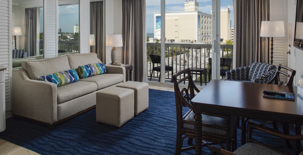 A Living Room Filled With Furniture And A Large Window