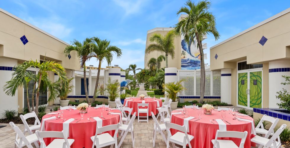 A Group Of Tables And Chairs Outside