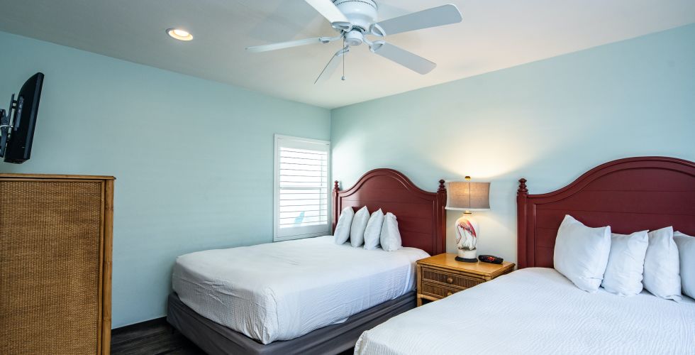 A Bedroom With Two Beds