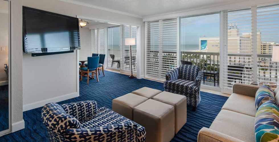 A Living Room Filled With Furniture And A Large Window