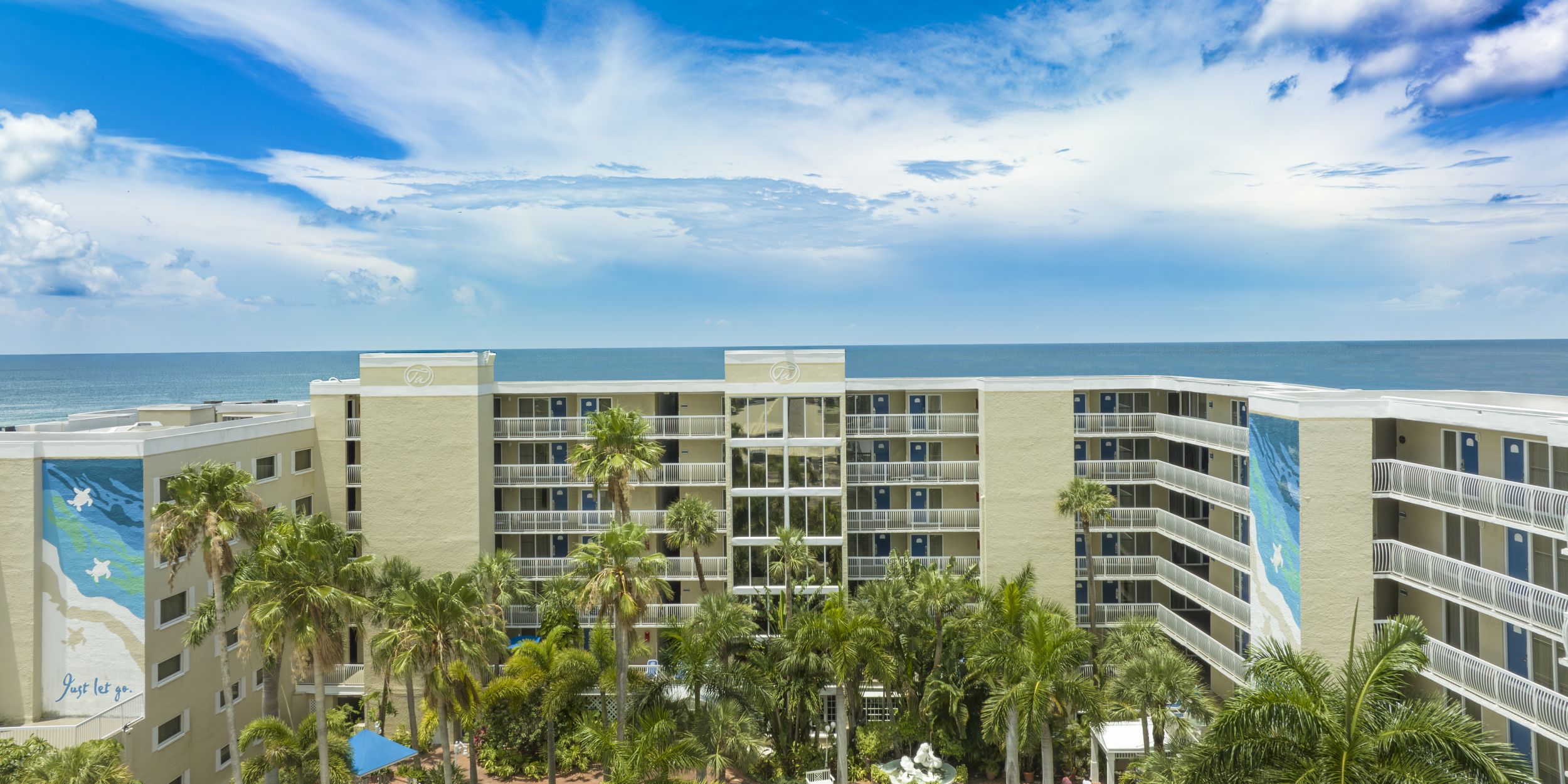 A Building With A Beach In The Background