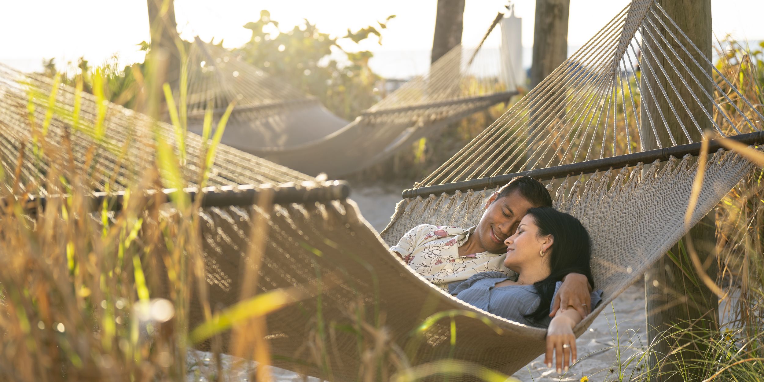A Man That Is Sitting In The Grass