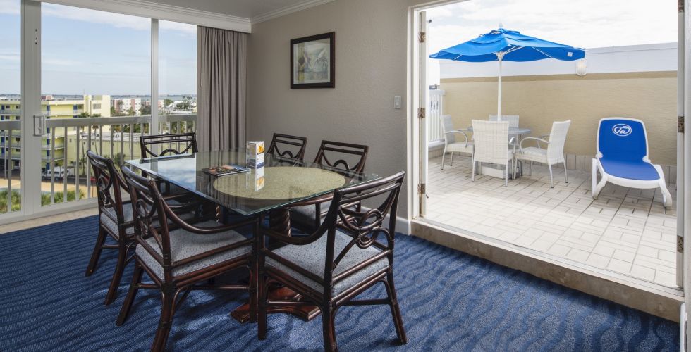 A Room Filled With Furniture And A Large Window