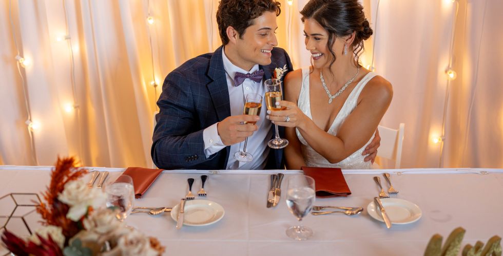 A Man And Woman Holding Wine Glasses