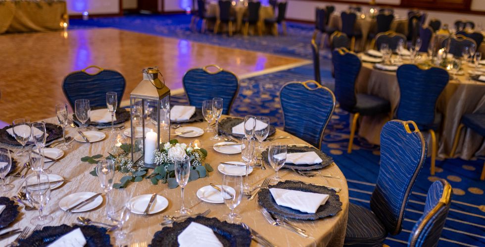 A Large Dining Table With Plates And Glasses On It