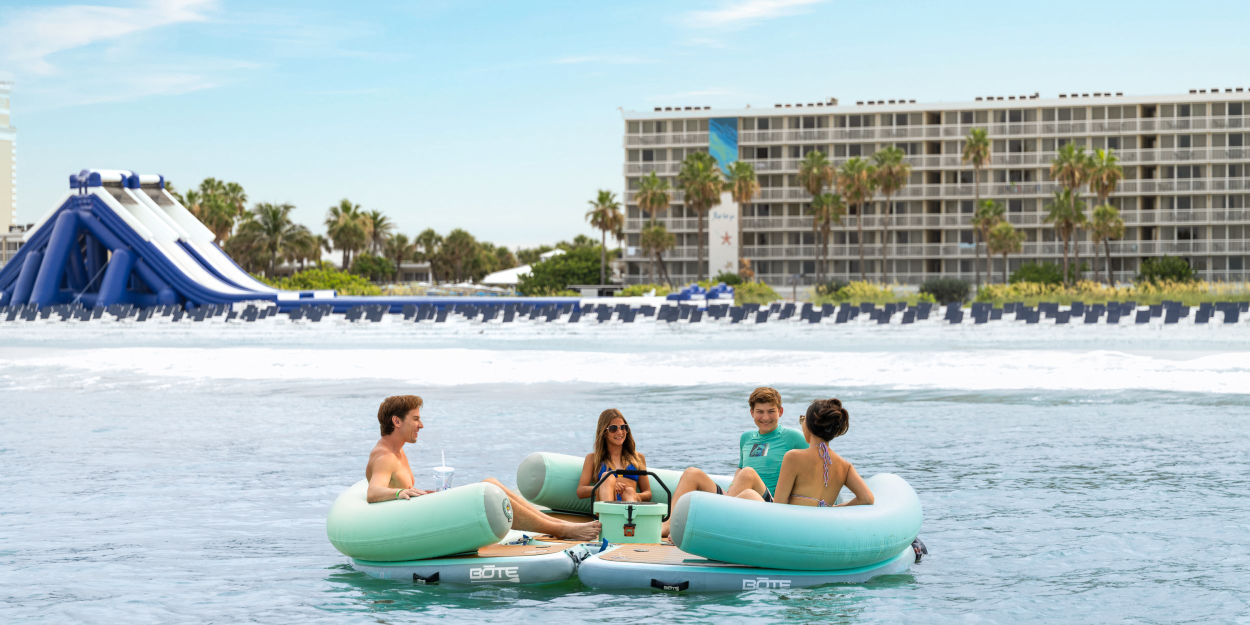 A Group Of People On A Raft In The Water