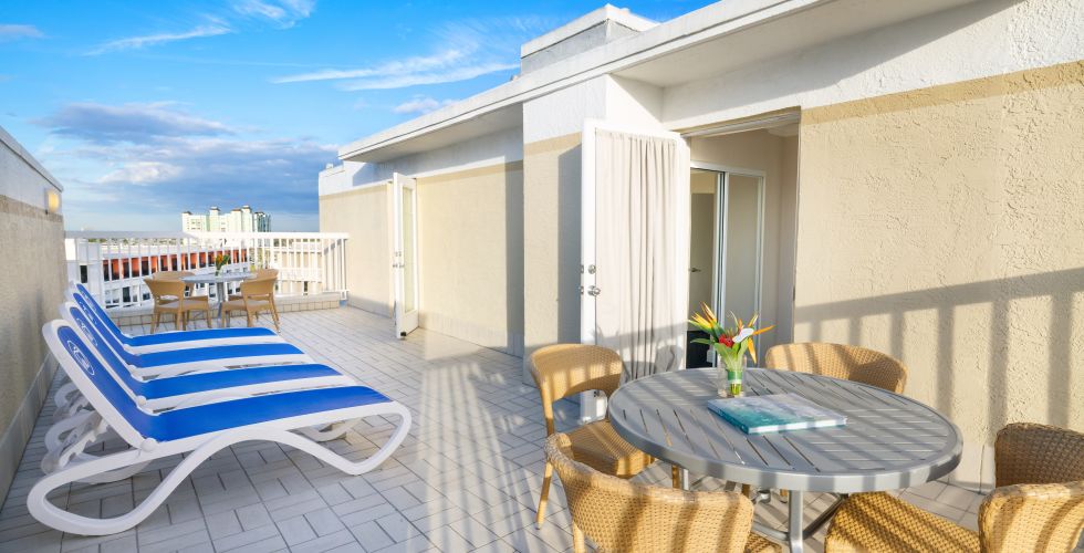 A Patio With Chairs And Tables