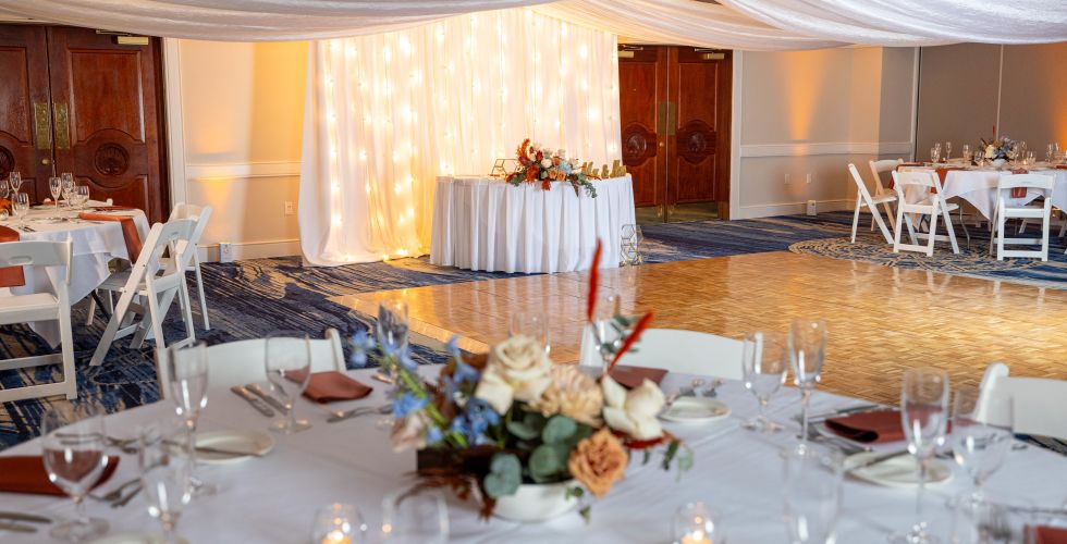 A Large Dining Room With Tables Set For A Wedding