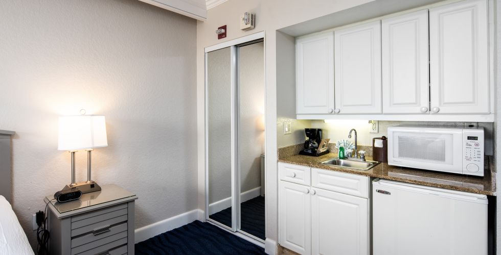A Kitchen With White Cabinets