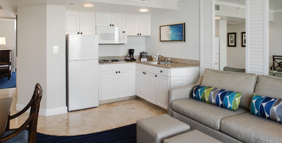 A Living Room Filled With Furniture And A Flat Screen Tv