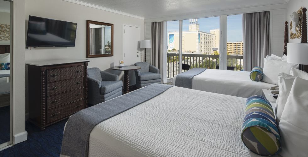 A Bedroom With A Large Bed In A Hotel Room